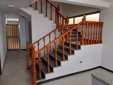 Timber handrail fitted along a staircase